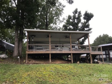 This 2008 31' Jayco RV w/ a custom-built covered structure on The Tillery Tradition Country Club in North Carolina - for sale on GolfHomes.com, golf home, golf lot