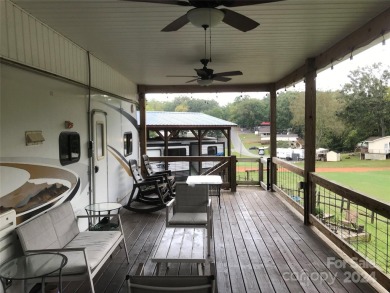 This 2008 31' Jayco RV w/ a custom-built covered structure on The Tillery Tradition Country Club in North Carolina - for sale on GolfHomes.com, golf home, golf lot