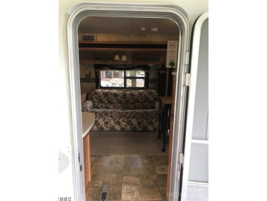 This 2008 31' Jayco RV w/ a custom-built covered structure on The Tillery Tradition Country Club in North Carolina - for sale on GolfHomes.com, golf home, golf lot