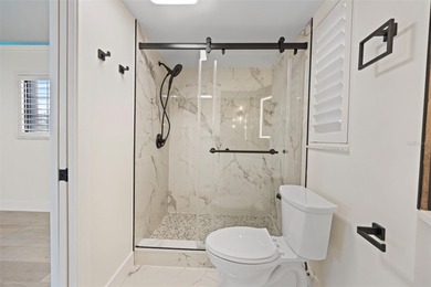 Welcome to the highly desirable Shore Acres neighborhood, where on Mangrove Bay Golf Course in Florida - for sale on GolfHomes.com, golf home, golf lot