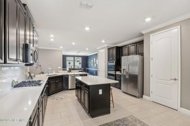 Welcome to this meticulously maintained 4-bedroom, 3-bathroom on The Palencia Club in Florida - for sale on GolfHomes.com, golf home, golf lot
