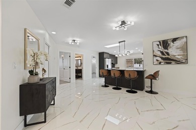 Welcome to the highly desirable Shore Acres neighborhood, where on Mangrove Bay Golf Course in Florida - for sale on GolfHomes.com, golf home, golf lot