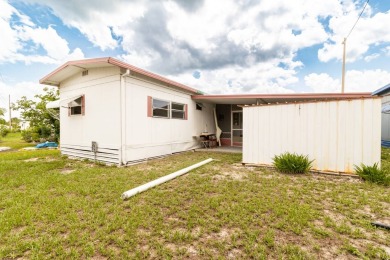 Nestled along the serene shores of Lake Smart, this charming on  in Florida - for sale on GolfHomes.com, golf home, golf lot