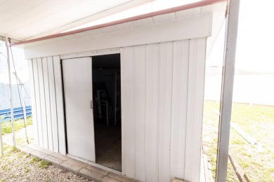 Nestled along the serene shores of Lake Smart, this charming on  in Florida - for sale on GolfHomes.com, golf home, golf lot