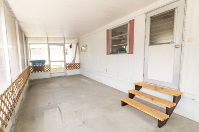 Nestled along the serene shores of Lake Smart, this charming on  in Florida - for sale on GolfHomes.com, golf home, golf lot