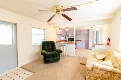 Nestled along the serene shores of Lake Smart, this charming on  in Florida - for sale on GolfHomes.com, golf home, golf lot