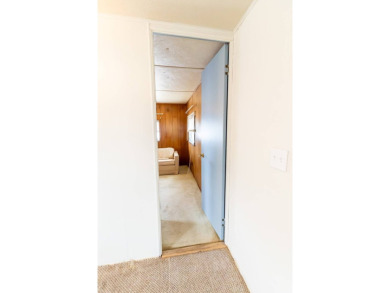 Nestled along the serene shores of Lake Smart, this charming on  in Florida - for sale on GolfHomes.com, golf home, golf lot