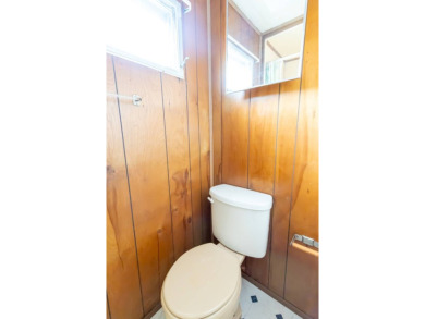 Nestled along the serene shores of Lake Smart, this charming on  in Florida - for sale on GolfHomes.com, golf home, golf lot