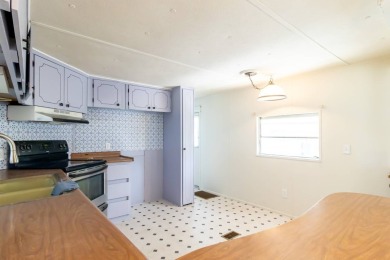 Nestled along the serene shores of Lake Smart, this charming on  in Florida - for sale on GolfHomes.com, golf home, golf lot