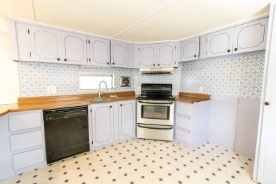 Nestled along the serene shores of Lake Smart, this charming on  in Florida - for sale on GolfHomes.com, golf home, golf lot