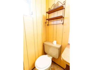 Nestled along the serene shores of Lake Smart, this charming on  in Florida - for sale on GolfHomes.com, golf home, golf lot