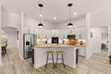 This elegant and inviting 5BR/4BA home is surrounded by lush on Plantation at Ponte Vedra in Florida - for sale on GolfHomes.com, golf home, golf lot