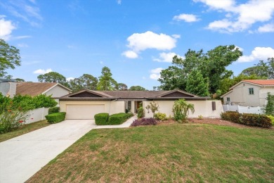 Welcome to this large ranch style, 4-bedroom, 2.5-bathroom home on Feather Sound Country Club in Florida - for sale on GolfHomes.com, golf home, golf lot