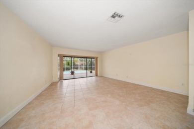 Welcome to this large ranch style, 4-bedroom, 2.5-bathroom home on Feather Sound Country Club in Florida - for sale on GolfHomes.com, golf home, golf lot