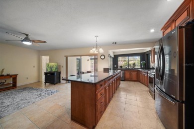 Welcome to this large ranch style, 4-bedroom, 2.5-bathroom home on Feather Sound Country Club in Florida - for sale on GolfHomes.com, golf home, golf lot