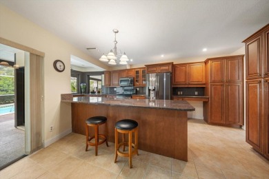 Welcome to this large ranch style, 4-bedroom, 2.5-bathroom home on Feather Sound Country Club in Florida - for sale on GolfHomes.com, golf home, golf lot