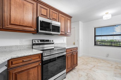 Come enjoy a golf course view from the top floor of your new on Boca Dunes Golf and Country Club in Florida - for sale on GolfHomes.com, golf home, golf lot