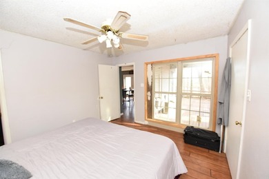 Nestled on a quiet street in the Bay, this charming home sits on on Indian Hills Country Club in Arkansas - for sale on GolfHomes.com, golf home, golf lot