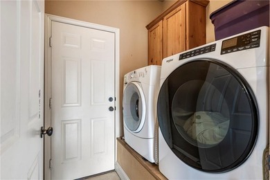 Enjoy easy living in this well-located home with walk-out on Bella Vista - Metfield Golf Complex and Country Club in Arkansas - for sale on GolfHomes.com, golf home, golf lot