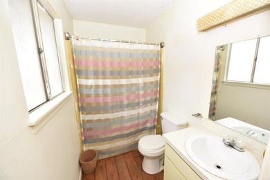 Nestled on a quiet street in the Bay, this charming home sits on on Indian Hills Country Club in Arkansas - for sale on GolfHomes.com, golf home, golf lot