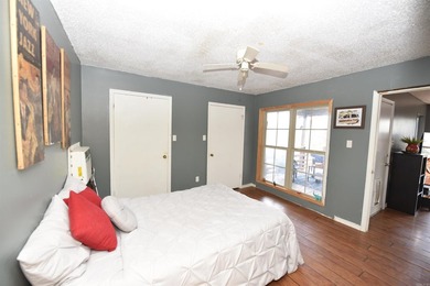 Nestled on a quiet street in the Bay, this charming home sits on on Indian Hills Country Club in Arkansas - for sale on GolfHomes.com, golf home, golf lot