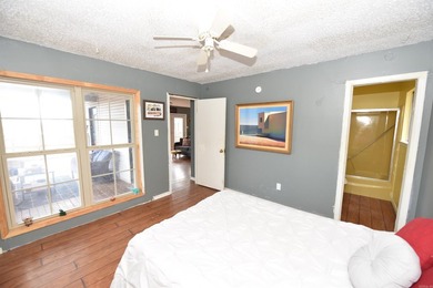 Nestled on a quiet street in the Bay, this charming home sits on on Indian Hills Country Club in Arkansas - for sale on GolfHomes.com, golf home, golf lot