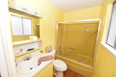 Nestled on a quiet street in the Bay, this charming home sits on on Indian Hills Country Club in Arkansas - for sale on GolfHomes.com, golf home, golf lot