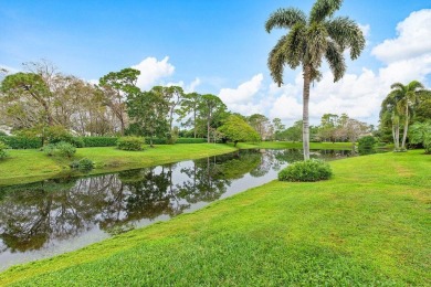 Nestled within lush landscaping and peaceful water views, this on Quail Ridge Golf Course and Country Club in Florida - for sale on GolfHomes.com, golf home, golf lot