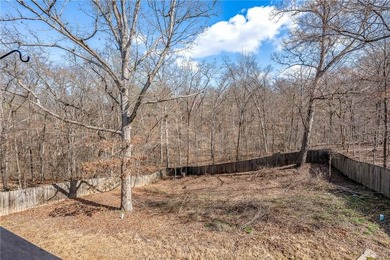 Enjoy easy living in this well-located home with walk-out on Bella Vista - Metfield Golf Complex and Country Club in Arkansas - for sale on GolfHomes.com, golf home, golf lot