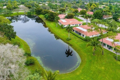 Nestled within lush landscaping and peaceful water views, this on Quail Ridge Golf Course and Country Club in Florida - for sale on GolfHomes.com, golf home, golf lot