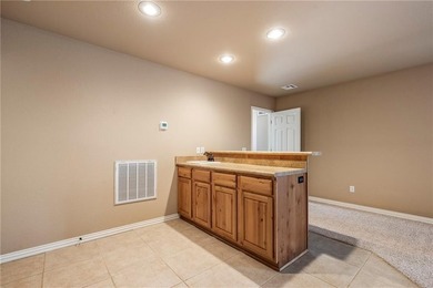 Enjoy easy living in this well-located home with walk-out on Bella Vista - Metfield Golf Complex and Country Club in Arkansas - for sale on GolfHomes.com, golf home, golf lot