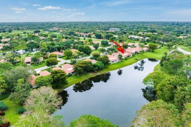 Nestled within lush landscaping and peaceful water views, this on Quail Ridge Golf Course and Country Club in Florida - for sale on GolfHomes.com, golf home, golf lot