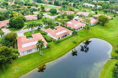 Nestled within lush landscaping and peaceful water views, this on Quail Ridge Golf Course and Country Club in Florida - for sale on GolfHomes.com, golf home, golf lot