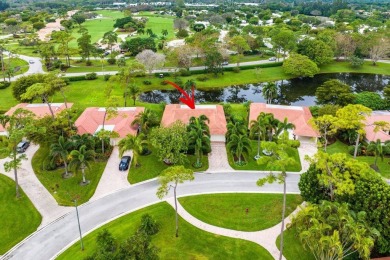 Nestled within lush landscaping and peaceful water views, this on Quail Ridge Golf Course and Country Club in Florida - for sale on GolfHomes.com, golf home, golf lot