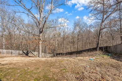 Enjoy easy living in this well-located home with walk-out on Bella Vista - Metfield Golf Complex and Country Club in Arkansas - for sale on GolfHomes.com, golf home, golf lot