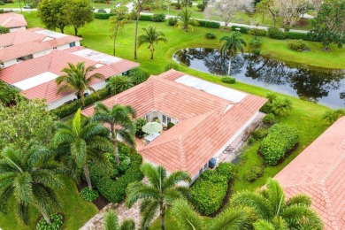 Nestled within lush landscaping and peaceful water views, this on Quail Ridge Golf Course and Country Club in Florida - for sale on GolfHomes.com, golf home, golf lot