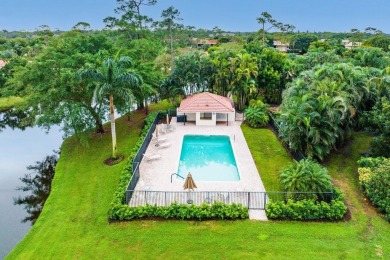 Nestled within lush landscaping and peaceful water views, this on Quail Ridge Golf Course and Country Club in Florida - for sale on GolfHomes.com, golf home, golf lot