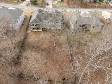 Enjoy easy living in this well-located home with walk-out on Bella Vista - Metfield Golf Complex and Country Club in Arkansas - for sale on GolfHomes.com, golf home, golf lot