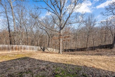 Enjoy easy living in this well-located home with walk-out on Bella Vista - Metfield Golf Complex and Country Club in Arkansas - for sale on GolfHomes.com, golf home, golf lot