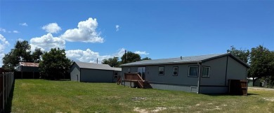 This is a newly remodeled mobile home in Horseshoe Bend Air Park on Horseshoe Bend Country Club in Texas - for sale on GolfHomes.com, golf home, golf lot