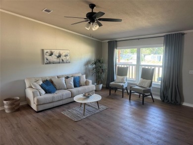 This is a newly remodeled mobile home in Horseshoe Bend Air Park on Horseshoe Bend Country Club in Texas - for sale on GolfHomes.com, golf home, golf lot