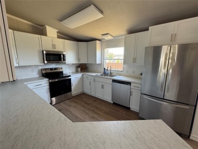 This is a newly remodeled mobile home in Horseshoe Bend Air Park on Horseshoe Bend Country Club in Texas - for sale on GolfHomes.com, golf home, golf lot