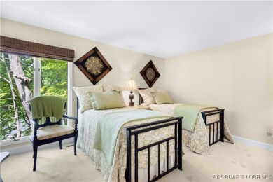 This charming 2,397 sq ft lakefront home in Tan-Tar-A Estates on The Oaks Golf Course in Missouri - for sale on GolfHomes.com, golf home, golf lot