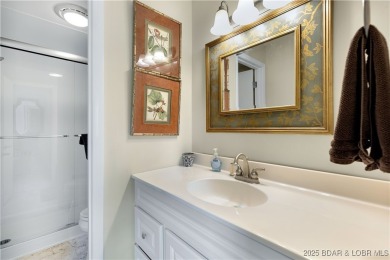 This charming 2,397 sq ft lakefront home in Tan-Tar-A Estates on The Oaks Golf Course in Missouri - for sale on GolfHomes.com, golf home, golf lot