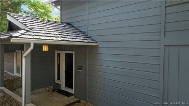 This charming 2,397 sq ft lakefront home in Tan-Tar-A Estates on The Oaks Golf Course in Missouri - for sale on GolfHomes.com, golf home, golf lot