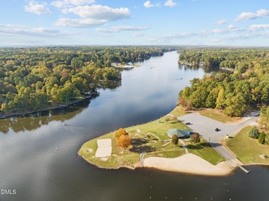 Welcome home to this charming three-bedroom, two-bath ranch on River Golf and Country Club at Lake Royale in North Carolina - for sale on GolfHomes.com, golf home, golf lot