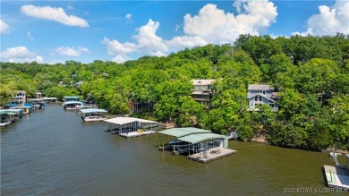 This charming 2,397 sq ft lakefront home in Tan-Tar-A Estates on The Oaks Golf Course in Missouri - for sale on GolfHomes.com, golf home, golf lot