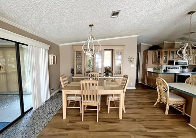 Updated 2/bd2/ba home offers an ideal blend of elegance & on Del Tura Golf and Country Club in Florida - for sale on GolfHomes.com, golf home, golf lot