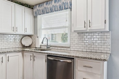 Welcome home to this beautifully updated 2-bedroom, 2-bath on Lake Henry Golf Club in Florida - for sale on GolfHomes.com, golf home, golf lot