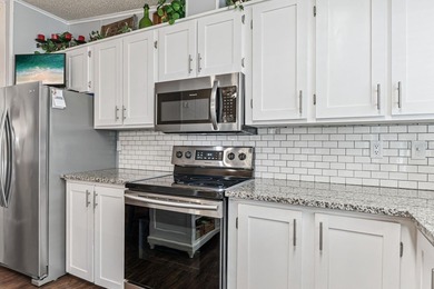 Welcome home to this beautifully updated 2-bedroom, 2-bath on Lake Henry Golf Club in Florida - for sale on GolfHomes.com, golf home, golf lot